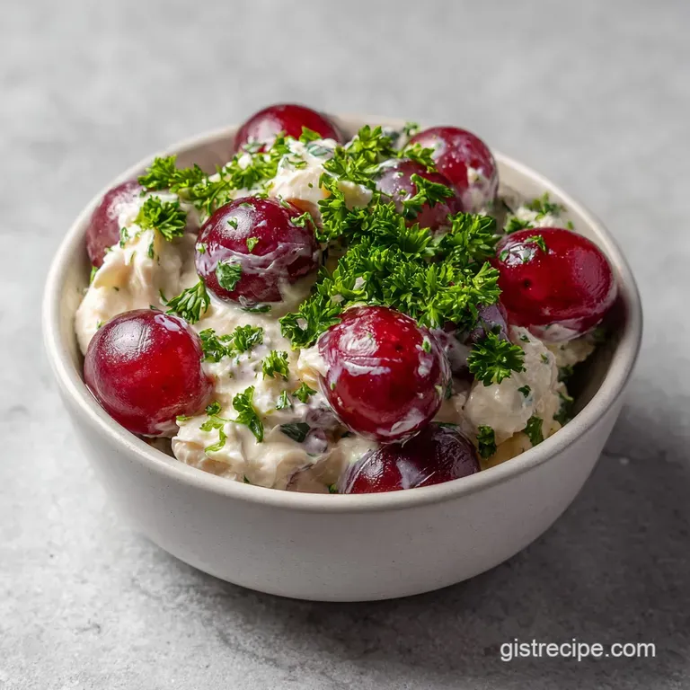 Elegant scoops of a creamy mixture on fresh romaine lettuce leaves, paired with a golden-brown toasted baguette.