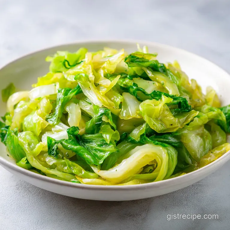 Individual serving of glistening fried cabbage with bacon, garnished with parsley, and sitting on a rustic, wooden plate.