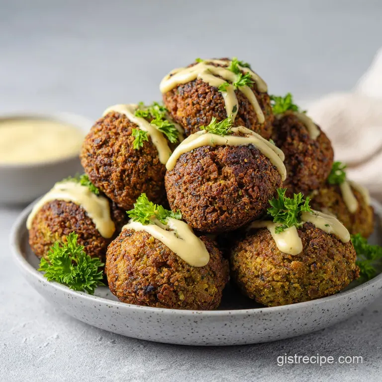 Neatly stacked falafel on a white plate, garnished with vibrant parsley and a swirl of tahini.