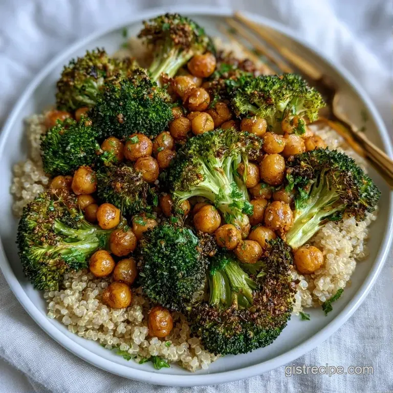 Charred broccoli and fluffy quinoa arranged in a white ceramic bowl, topped with a swirl of lemon cream and parsley.