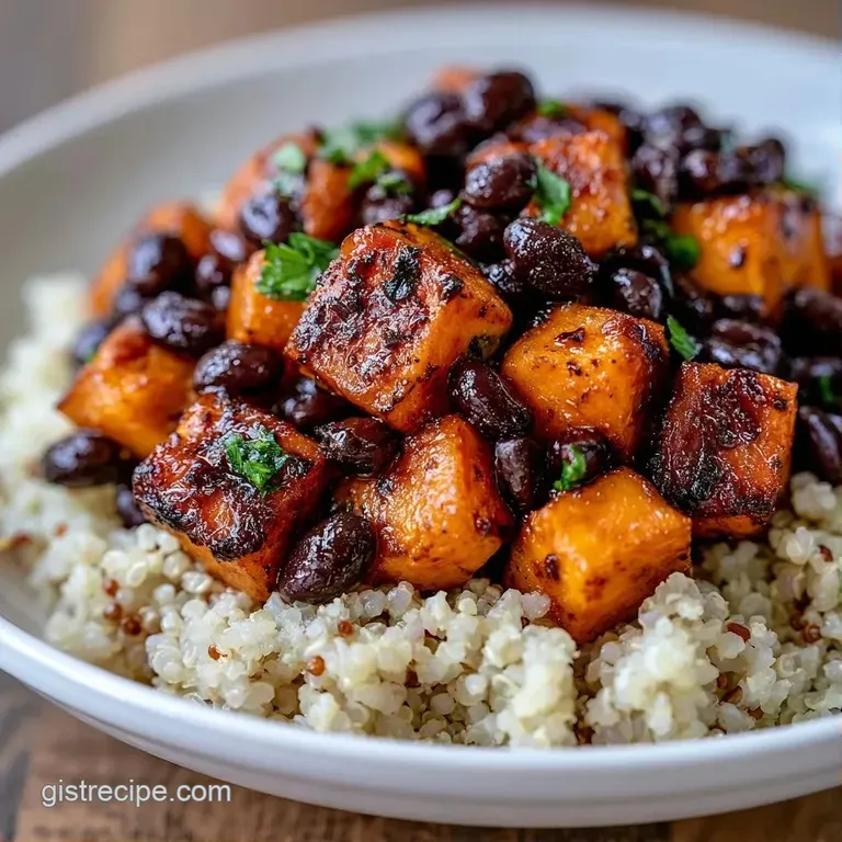 Vibrant bowl of golden sweet potatoes and fluffy quinoa topped with sliced avocado and a drizzle of creamy tahini.