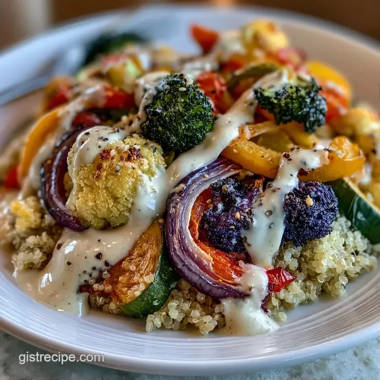 Artfully arranged charred root vegetables and fluffy white quinoa topped with a drizzle of creamy tahini sauce.
