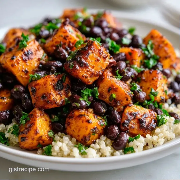 A vibrant bowl of fluffy grains, dark legumes, and charred orange potato chunks topped with fresh green cilantro.