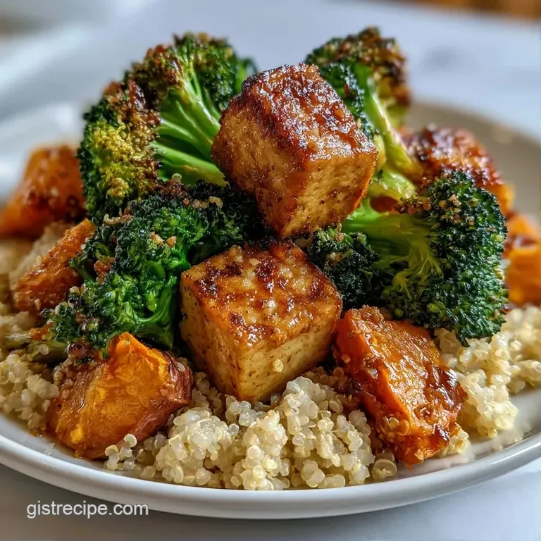 A vibrant arrangement of diced rainbow vegetables and fluffy grains topped with creamy tahini in a matte bowl.
